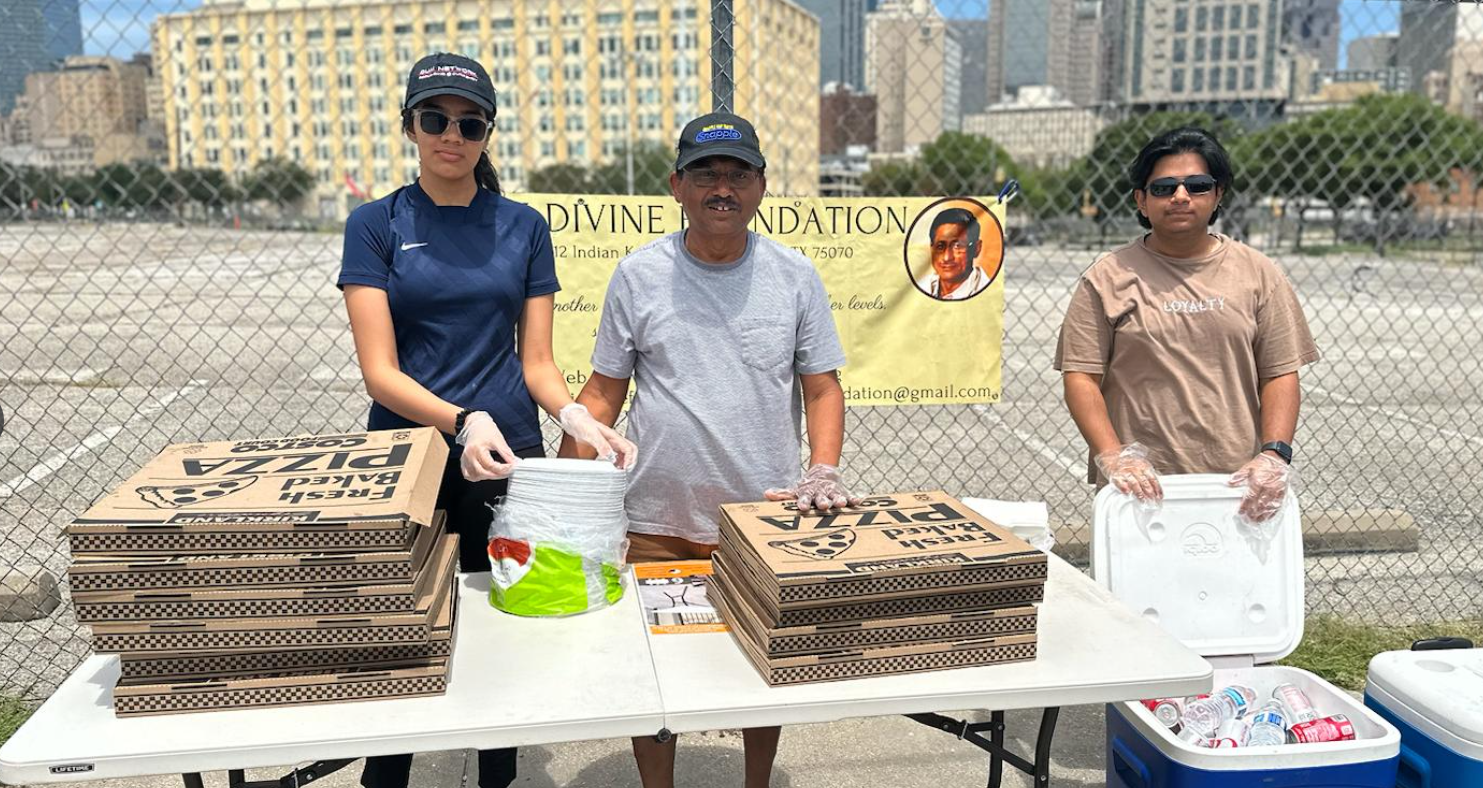 Volunteers preparing pizza boxes and water for distribution
