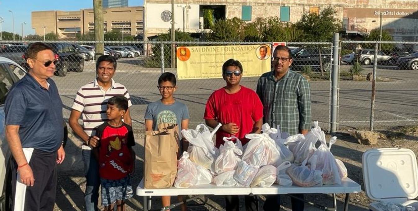 Community volunteers distributing food packages